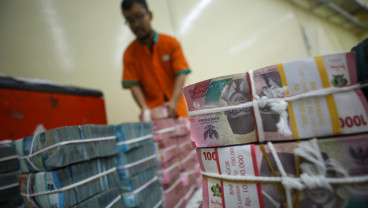 Rupiah Ditutup Melemah ke Rp16.855 per Dolar AS